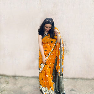 Founder wearing Amber & Aloof amber cotton cat print saree with fishbone motifs, sleeping cat border and black zari pallu paired with a black blouse, Zoomies Collection TTW