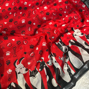 Bone Voyage red cotton dog print saree closeup with paw print and bone motifs, illustrated dog border and black zari stripe pallu, Zoomies Collection