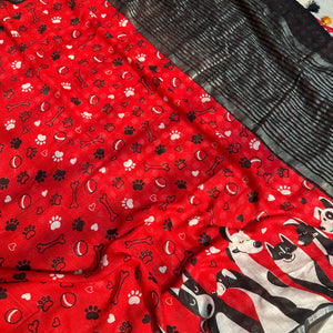 Bone Voyage red cotton dog print saree closeup with paw print and bone motifs, illustrated dog border and black zari stripe pallu, Zoomies Collection