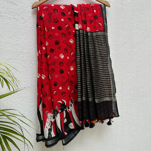 Bone Voyage red cotton dog print saree with paw print and bone motifs, illustrated dog border and black zari stripe pallu, Zoomies Collection
