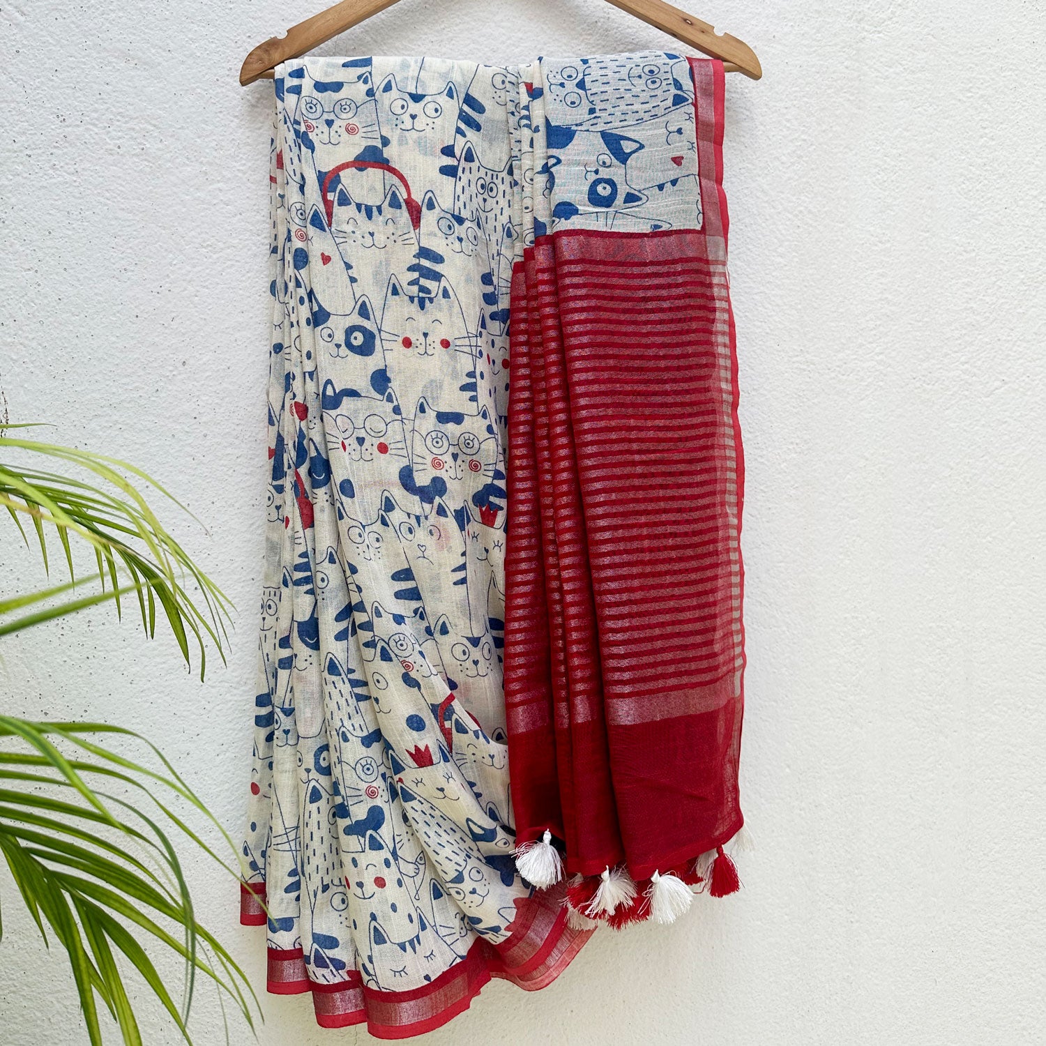 Purr-suasion ivory cotton saree with blue illustrated cat crowd print and bold red zari pallu, Zoomies Collection by Thread Weavers