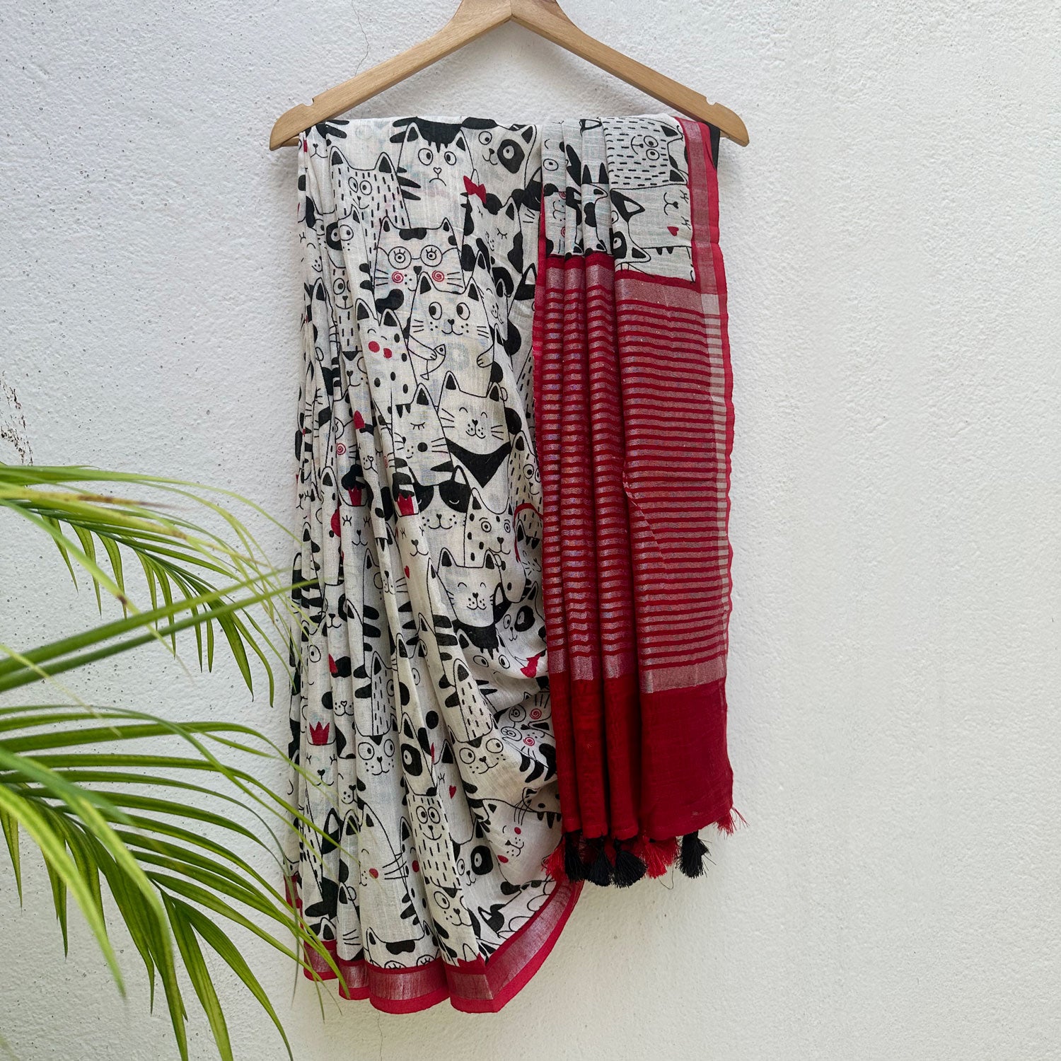 The Great Catsby ivory cotton saree with black illustrated cat crowd print and crimson red zari pallu, Zoomies Collection Thread Weavers