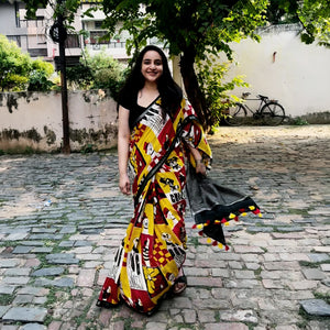 Founder wearing Who Let The Dogs Dress Up yellow red patchwork dog print saree with illustrated dog panels and black zari pallu, Zoomies Collection TTW