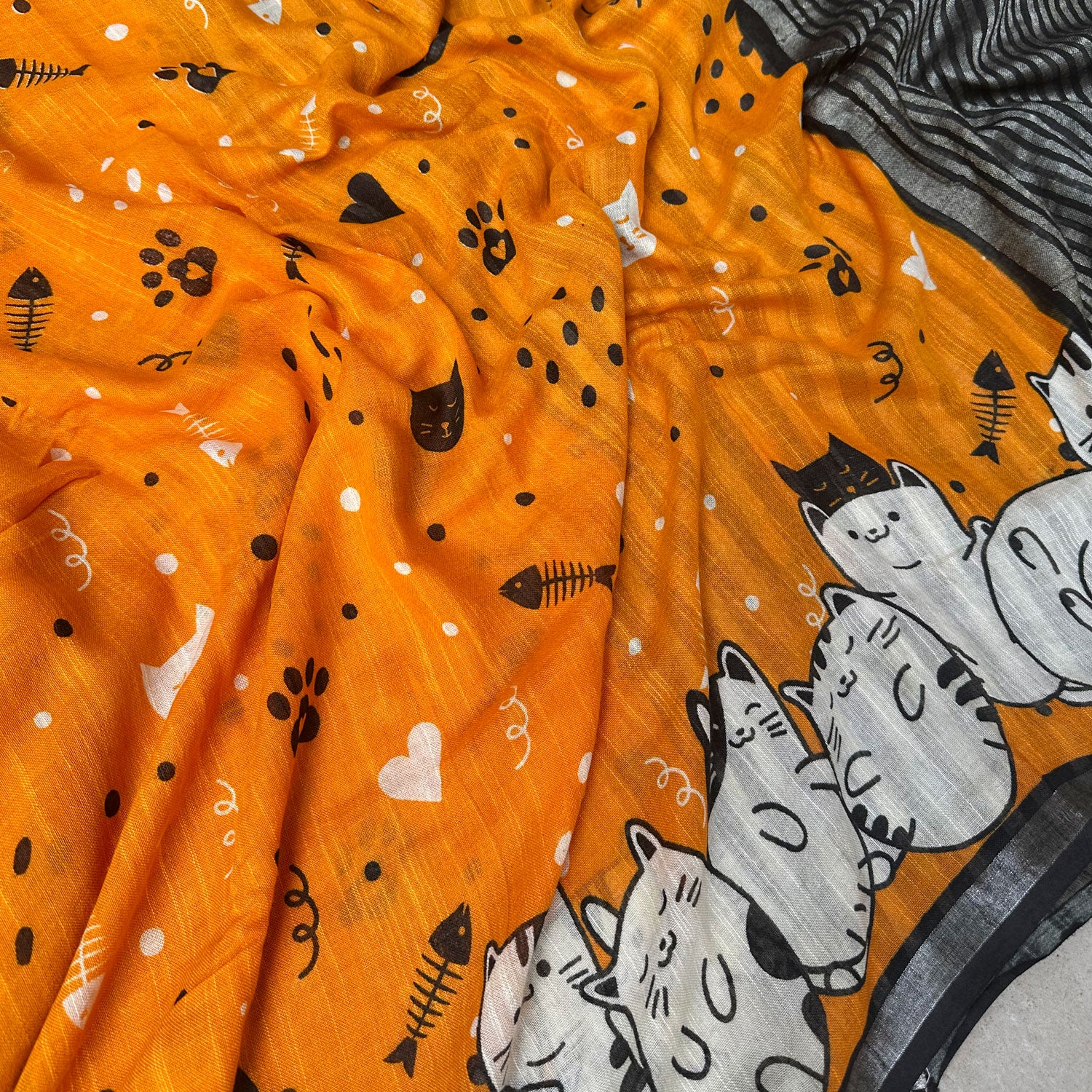 Amber & Aloof amber cotton cat print saree closeup - with fishbone motifs, paws, hearts, confettis and sleeping cat border, Zoomies Collection TTW