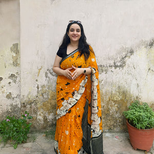 Founder wearing Amber & Aloof amber cotton cat print saree with fishbone motifs, sleeping cat border and black zari pallu paired with a black blouse, Zoomies Collection TTW