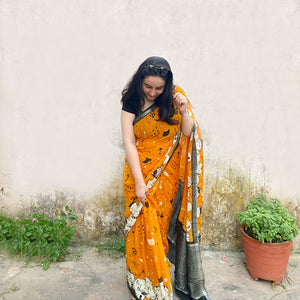 Founder wearing Amber & Aloof amber cotton cat print saree with fishbone motifs, sleeping cat border and black zari pallu paired with a black blouse, Zoomies Collection TTW