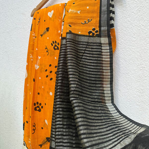 Amber & Aloof amber cotton cat print saree with fishbone motifs, paws, hearts, confettis, sleeping cat border and black zari pallu, Zoomies Collection TTW