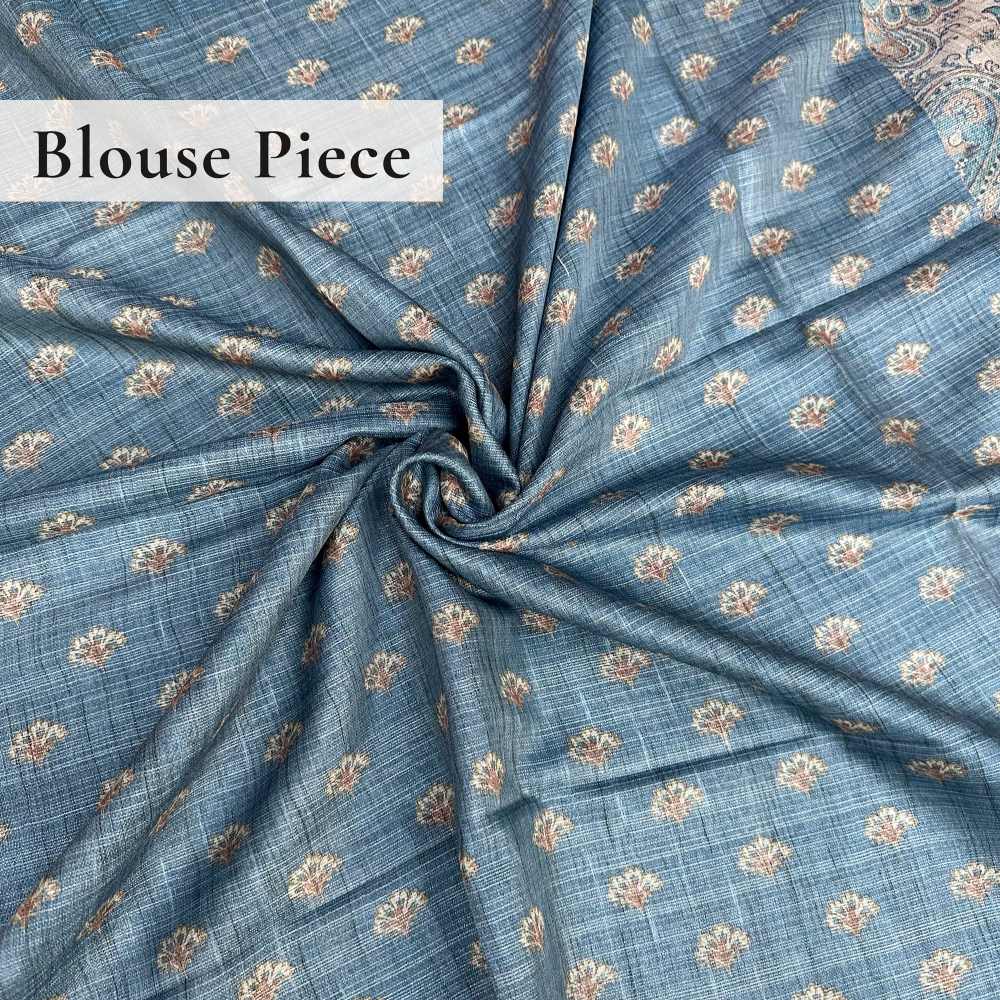 Teal-blue blouse with floral all over print.