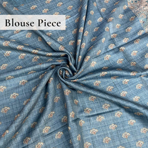 Teal-blue blouse with floral all over print.