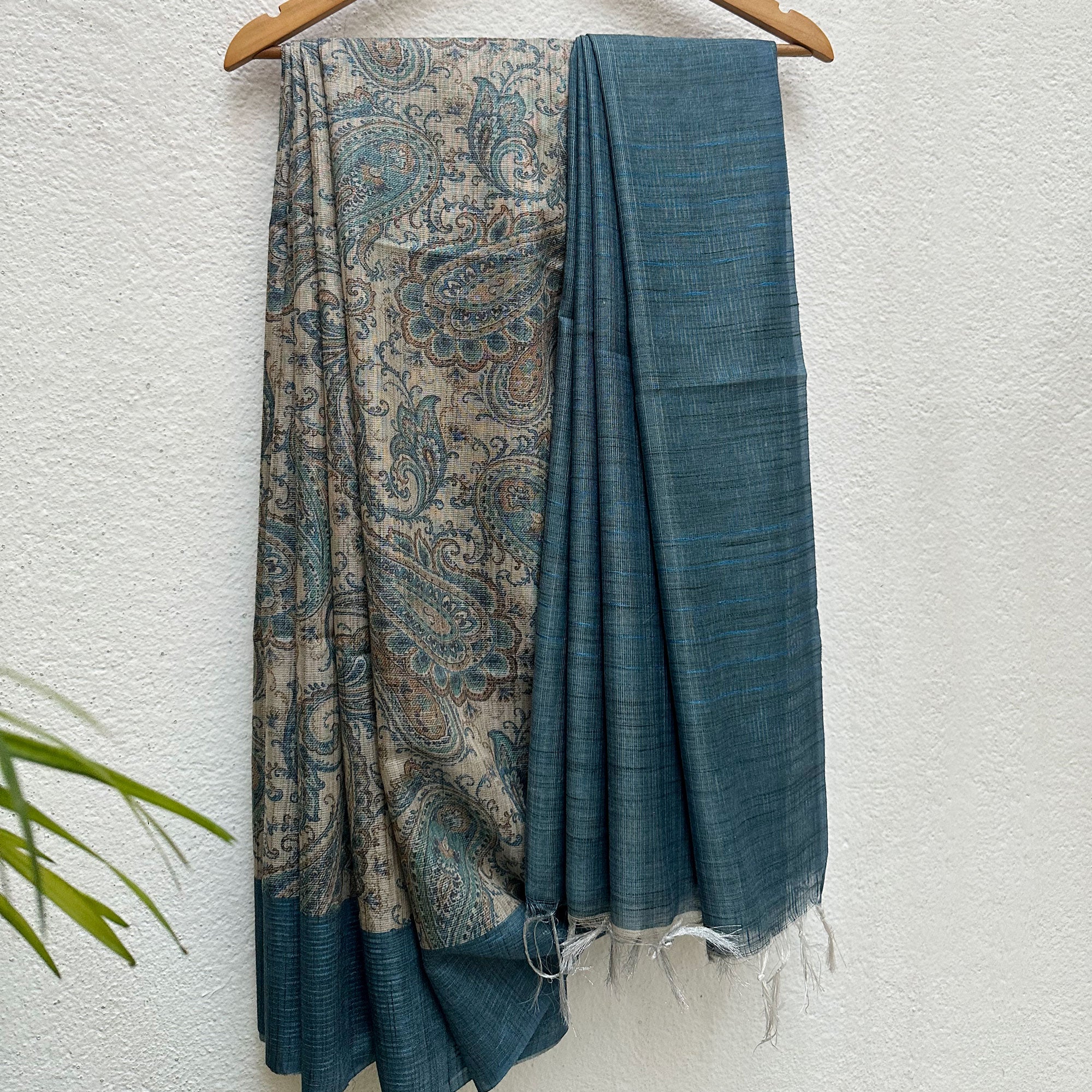 Full side drape of the Ambi tissue silk saree showing the paisley body and solid teal-blue pallu