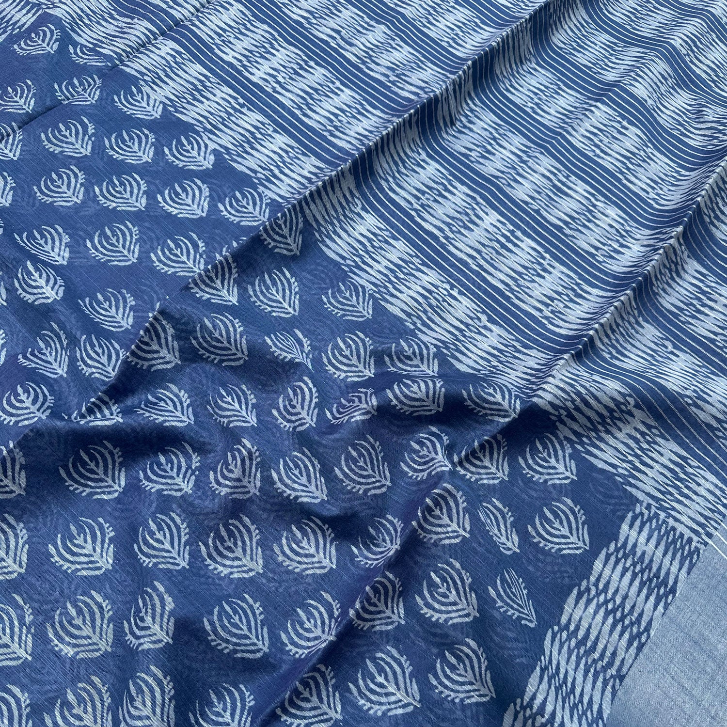 Closeup of Peacock feather allover hand block print indigo cotton silk saree  – The Thread Weavers