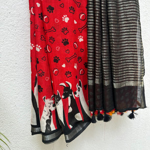 Bone Voyage red cotton dog print saree with paw print and bone motifs, illustrated dog border and black zari stripe pallu, Zoomies Collection
