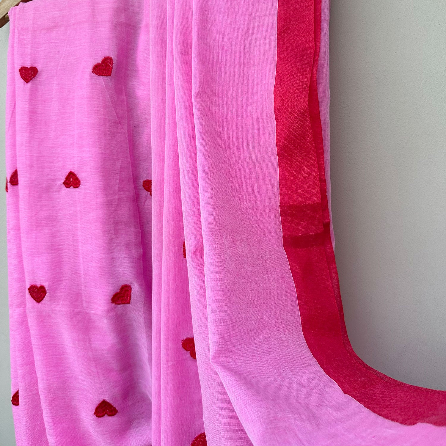 Red Hearts Embroidered on Pink Base Saree with Red Tassels and Border