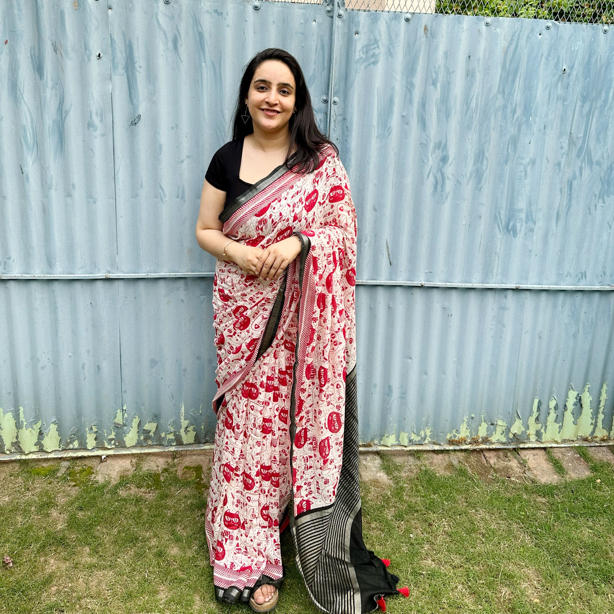 Founder wearing Cat Got Your Heart cotton saree in red and white cat print with black border, styled with black blouse, by The Thread Weavers