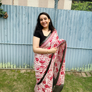 Founder wearing Cat Got Your Heart cotton saree in red and white cat print with black border, styled with black blouse, by The Thread Weavers