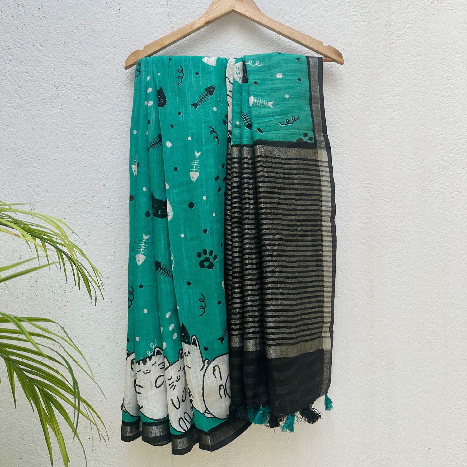 Cat Nap Playtime teal cotton print saree with fishbone motifs, sleeping cat border and black stripe zari pallu, Zoomies Collection