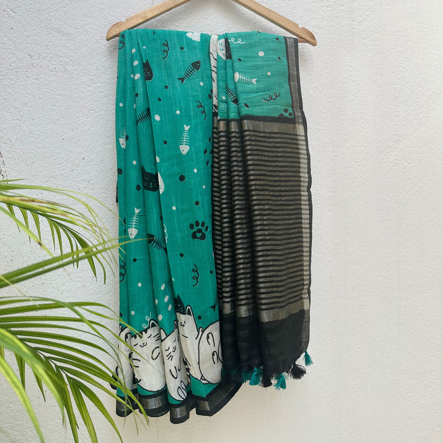 Cat Nap Playtime teal cotton print saree with fishbone motifs, sleeping cat border and black stripe zari pallu, Zoomies Collection