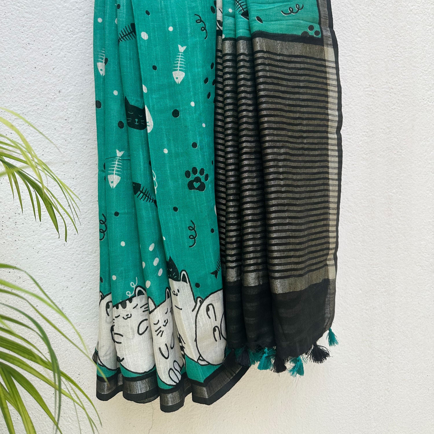 Cat Nap Playtime teal cotton print saree with fishbone motifs, sleeping cat border and black stripe zari pallu, Zoomies Collection