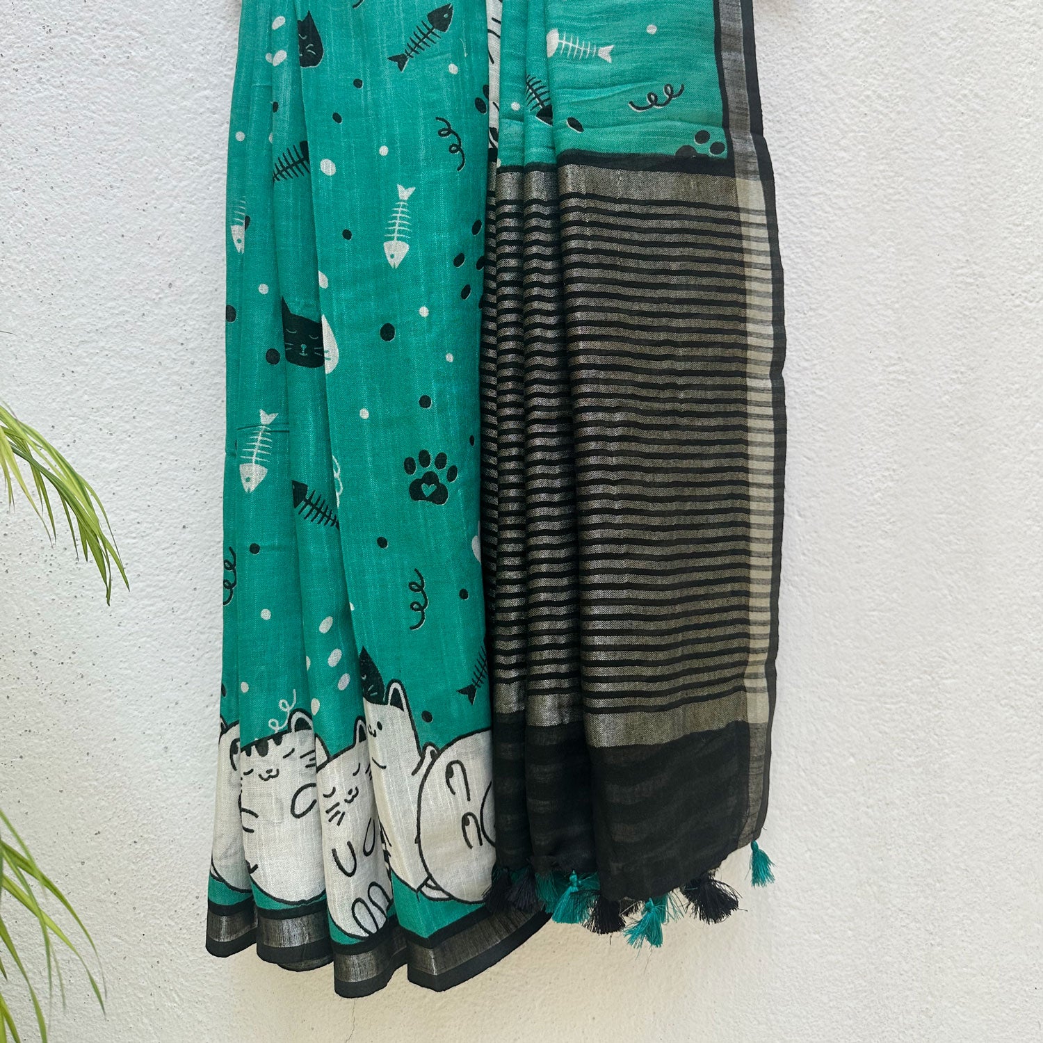 Cat Nap Playtime teal cotton print saree with fishbone motifs, sleeping cat border and black stripe zari pallu, Zoomies Collection