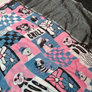 Dog Mom Actually pink blue patchwork dog print saree Closeup with illustrated dog panels and black zari pallu, Zoomies Collection Thread Weavers