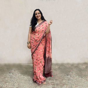 Founder wearing Ears First coral cotton beagle print saree with daisy florals and dark maroon zari pallu paired with white blouse, Zoomies Collection by The Thread Weavers