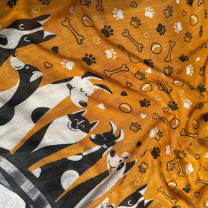 Golden Paws mustard cotton dog print saree closeup with paw print bone motifs, illustrated dog border and black zari pallu, Zoomies Collection
