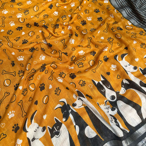 Golden Paws mustard cotton dog print saree closeup with paw print bone motifs, illustrated dog border and black zari pallu, Zoomies Collection