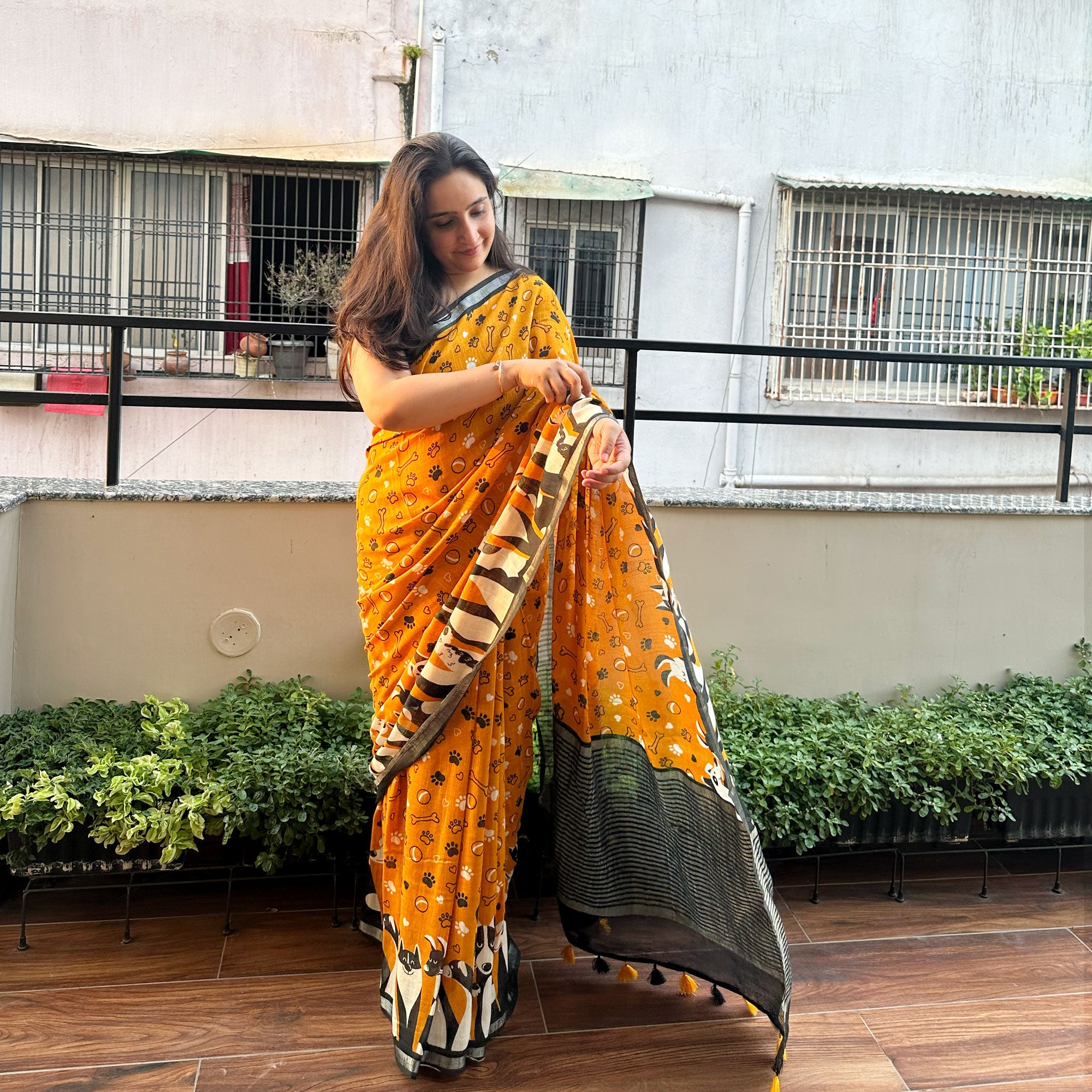 Golden Paws mustard cotton dog print saree with paw print bone motifs, illustrated dog border and black zari pallu, Zoomies Collection