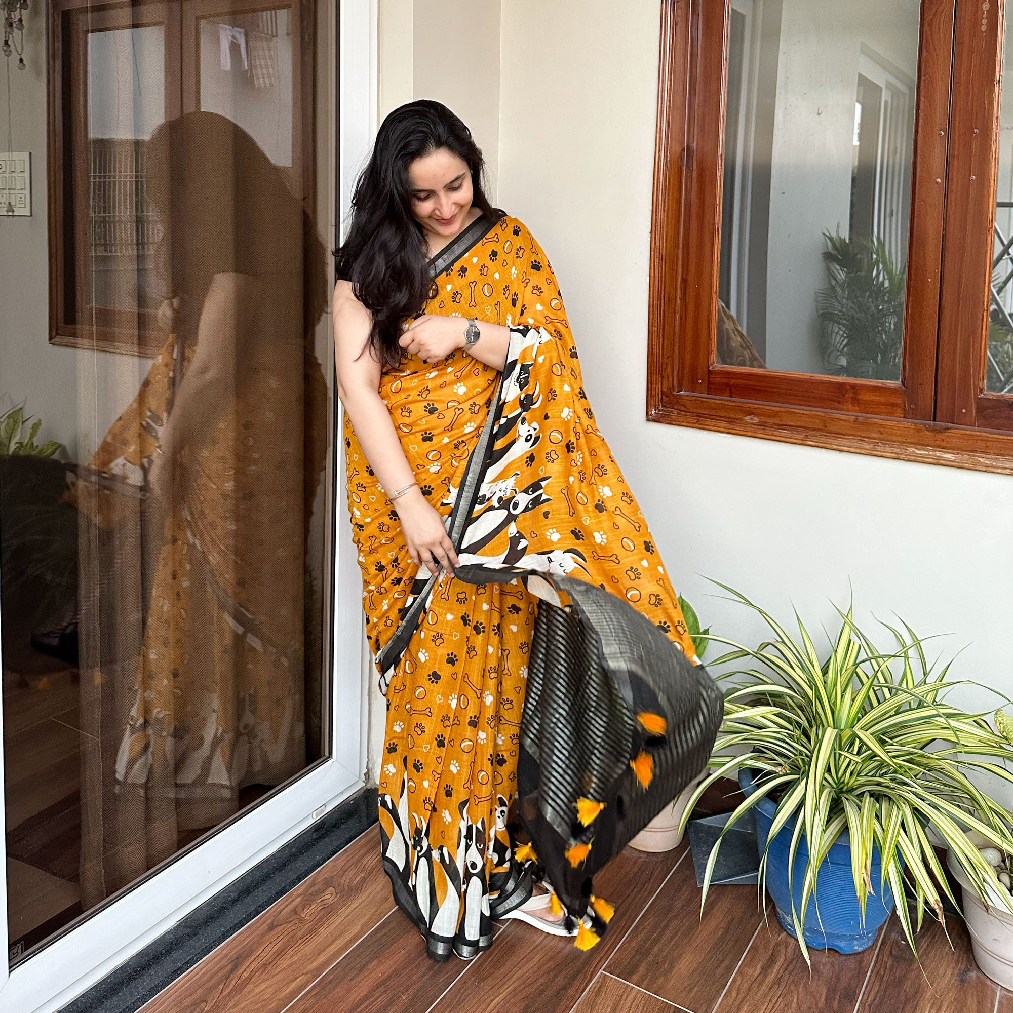 Golden Paws mustard cotton dog print saree with paw print bone motifs, illustrated dog border and black zari pallu, Zoomies Collection