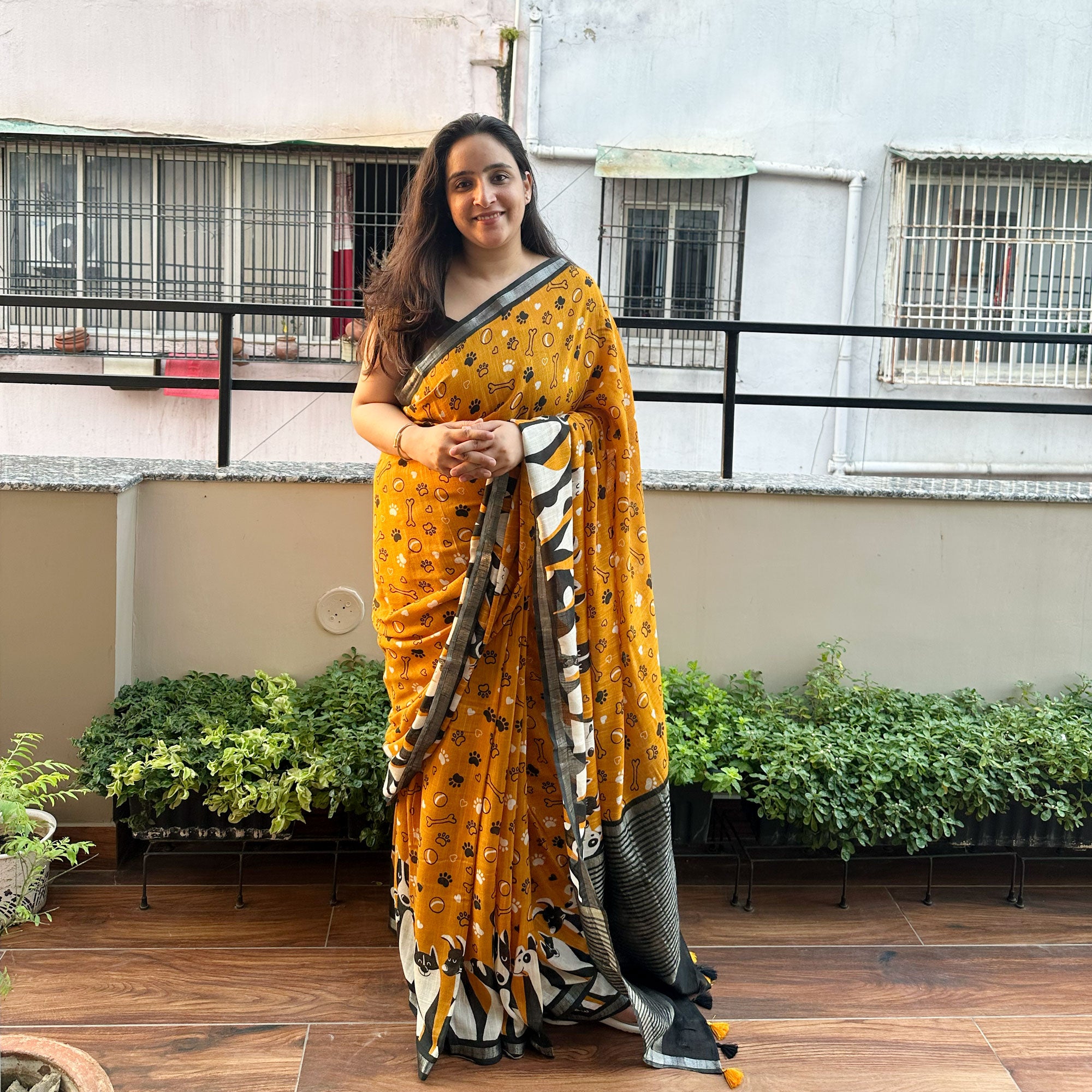 Golden Paws mustard cotton dog print saree with paw print bone motifs, illustrated dog border and black zari pallu, Zoomies Collection