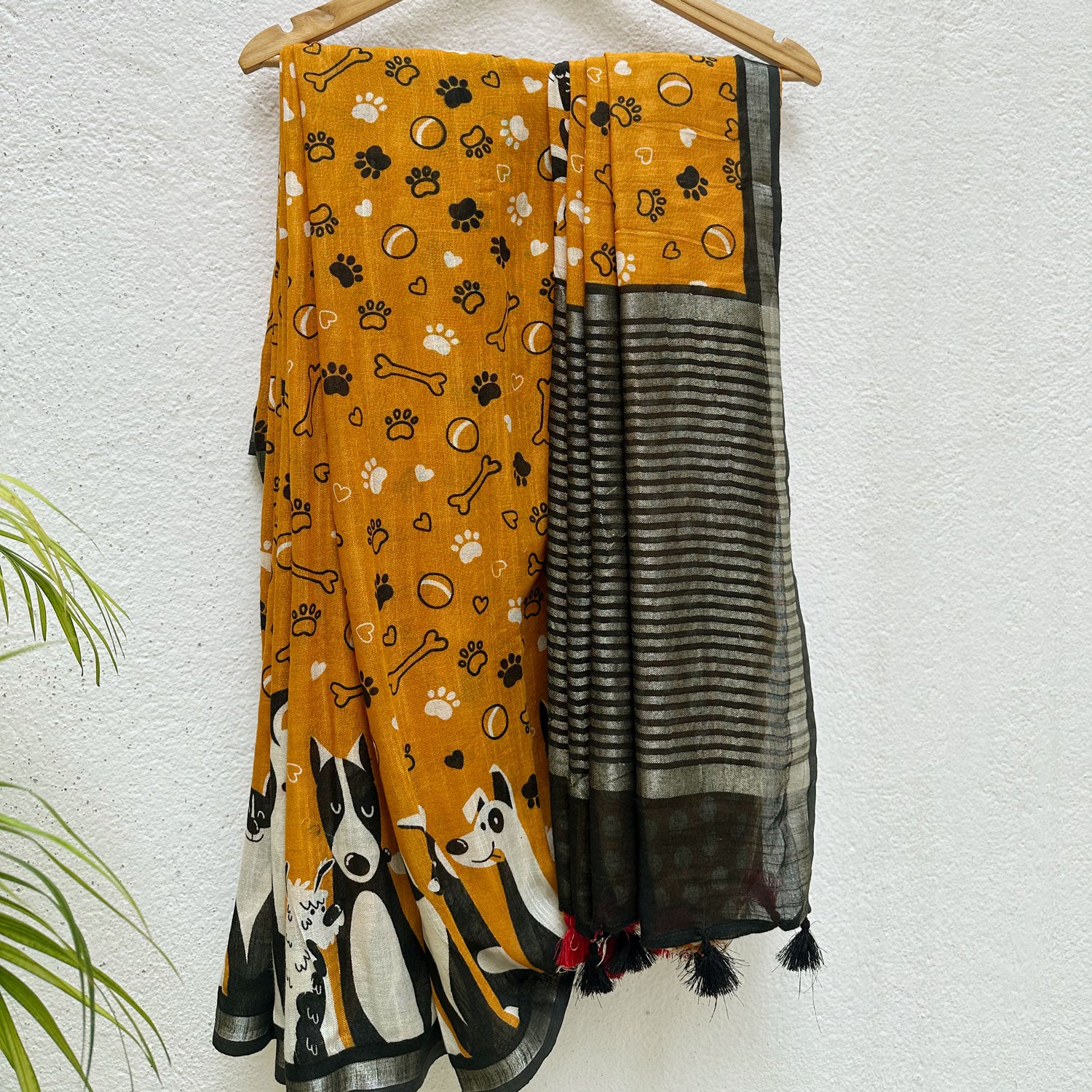 Golden Paws mustard cotton dog print saree with paw print bone motifs, illustrated dog border and black zari pallu, Zoomies Collection