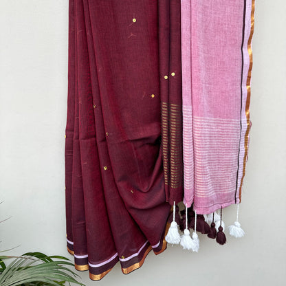Handcrafted mul cotton saree with delicate sequin embroidery, contrast pink pallu and contemporary Indian design.