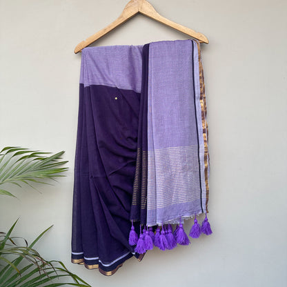Jamuni Dhoop mul cotton saree in deep violet and lavender with delicate embroidery and handcrafted tassels.