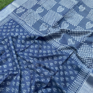 Closeup of sun buti scatter print and feathered leaf paisley border on indigo cotton silk – Manah