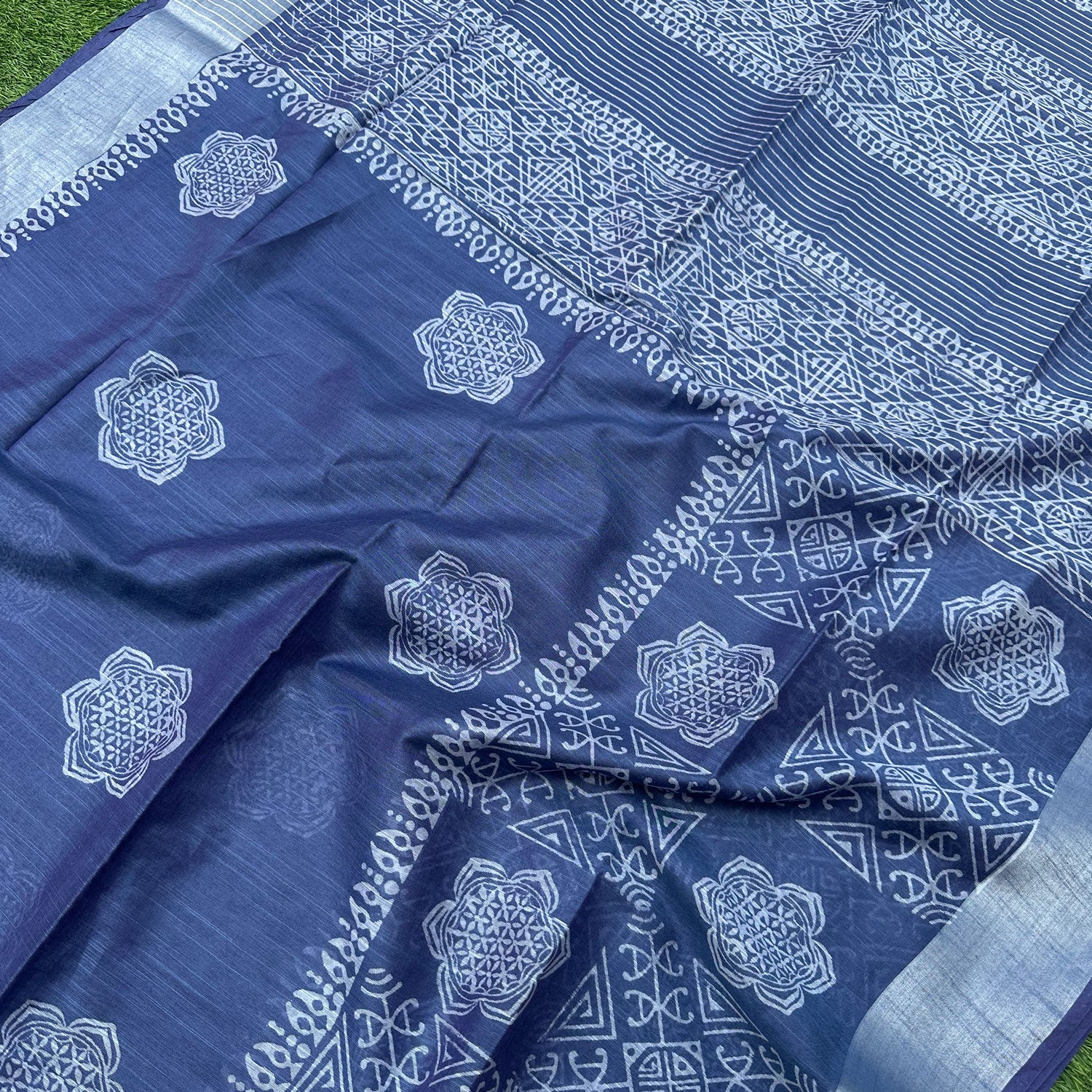 Closeup of Flower of Life mandala and yantra border hand block print on indigo cotton silk – Padma