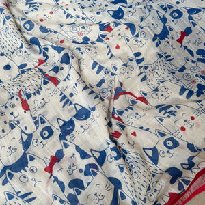 Purr-suasion ivory cotton saree closeup with blue illustrated cat crowd print and bold red zari pallu, Zoomies Collection by Thread Weavers