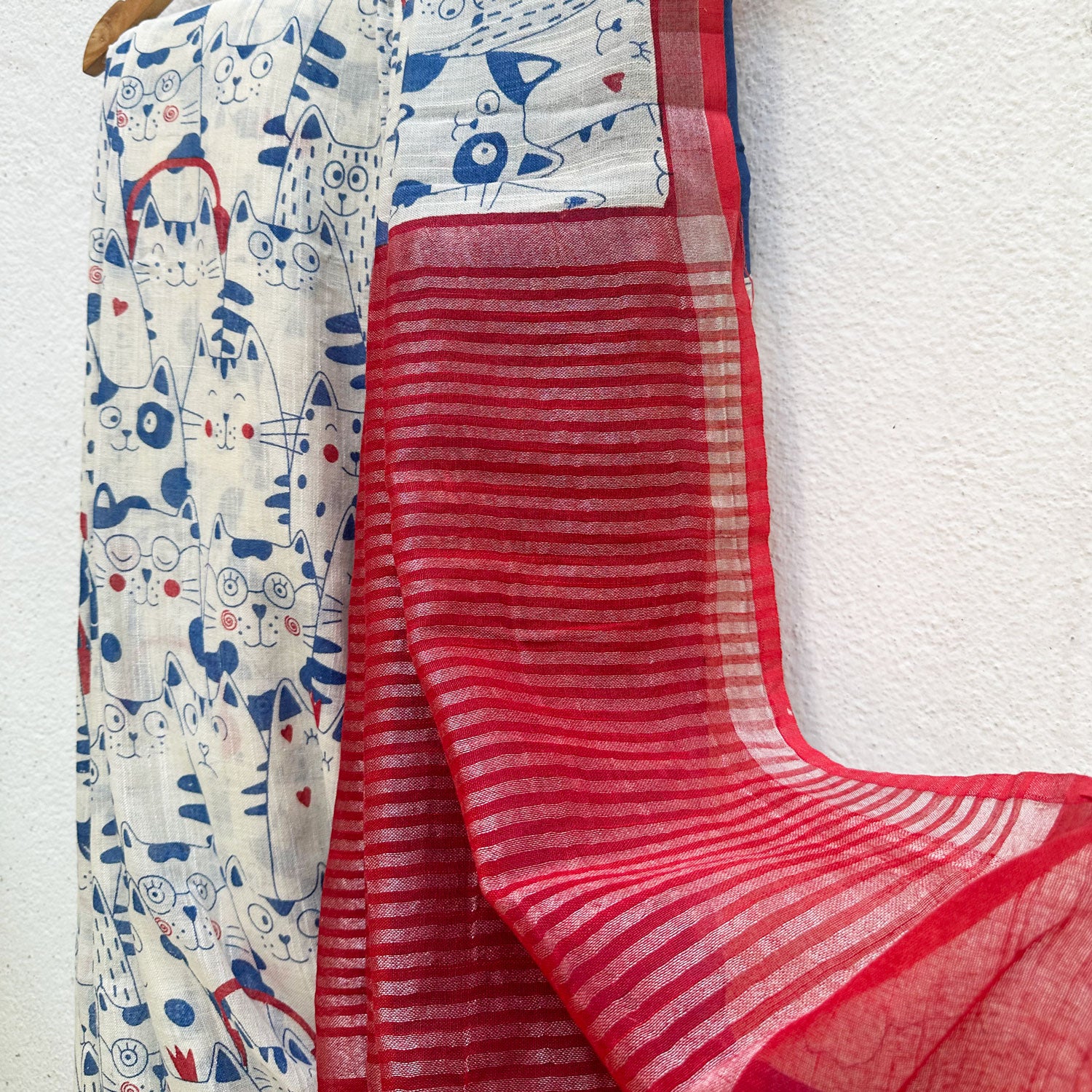 Purr-suasion ivory cotton saree with blue illustrated cat crowd print and bold red zari pallu, Zoomies Collection by Thread Weavers