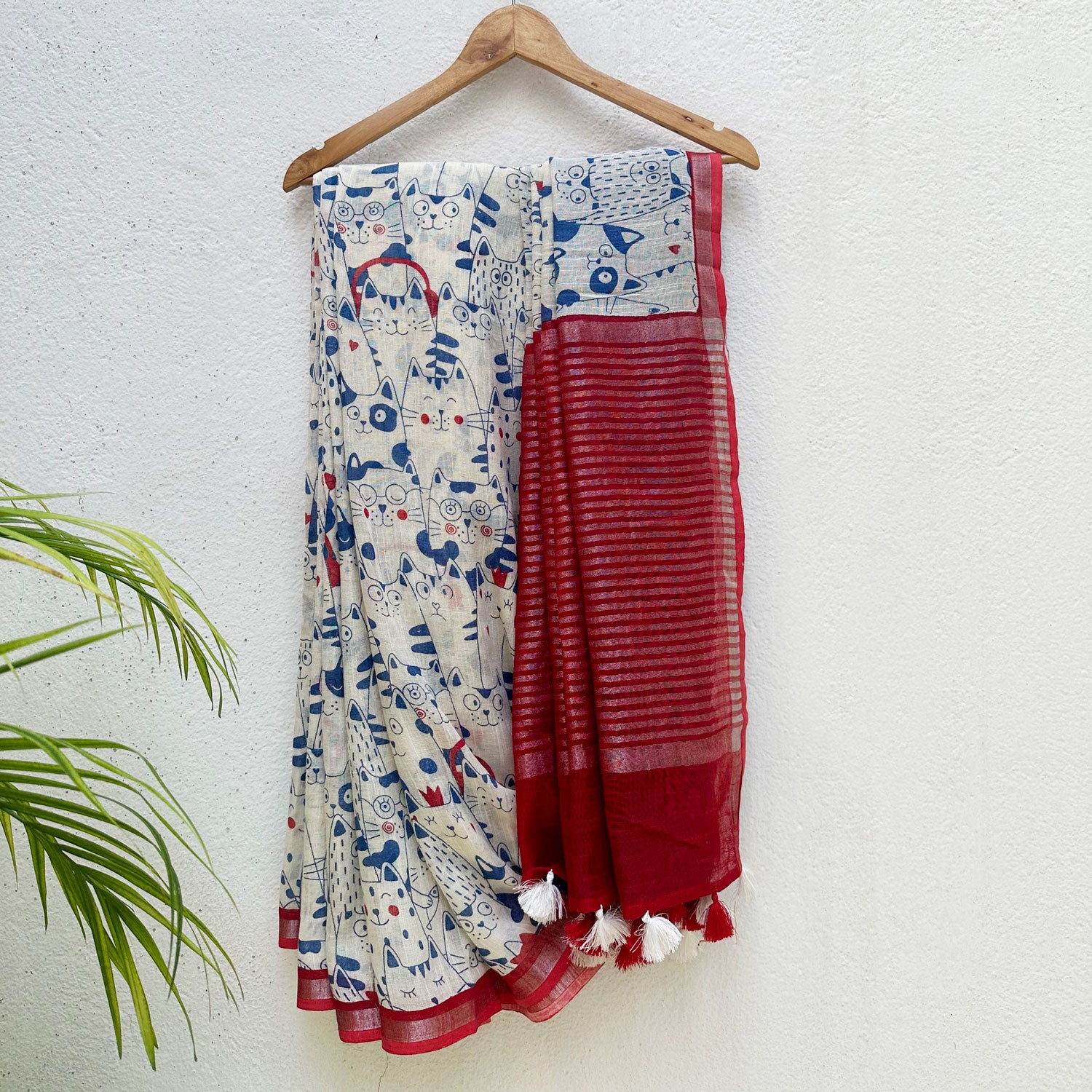 Purr-suasion ivory cotton saree with blue illustrated cat crowd print and bold red zari pallu, Zoomies Collection by Thread Weavers