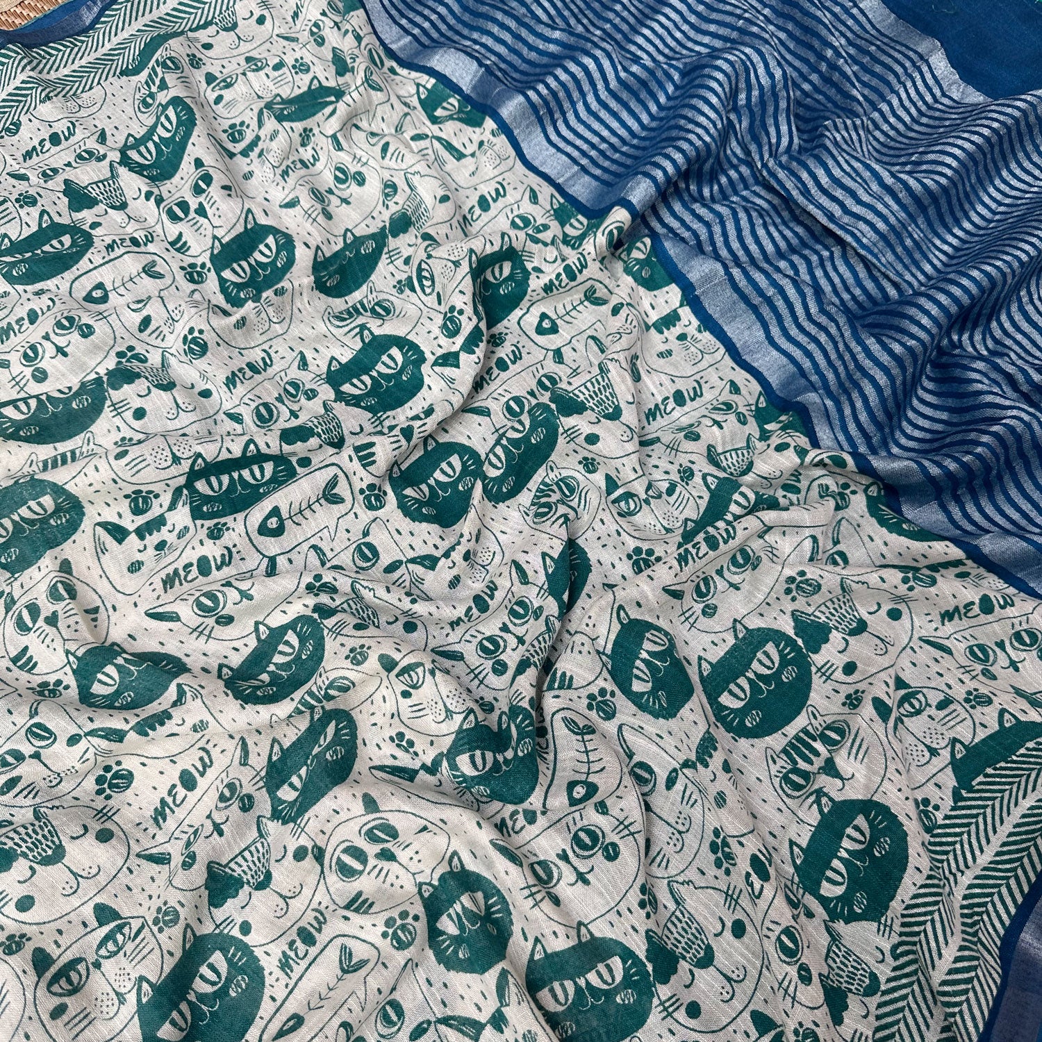Say It Louder ivory cotton saree closeup with teal meow cat face print, chevron border and navy zari pallu, Zoomies Collection Thread Weavers