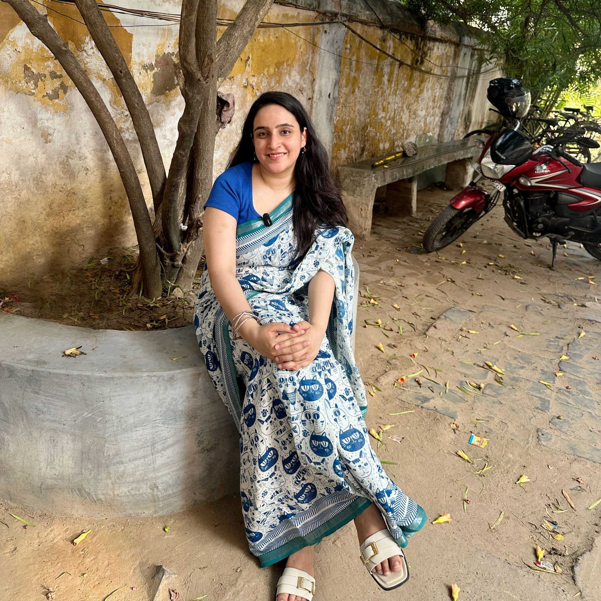Founder wearing Catsablanca ivory cotton saree with navy meow cat face print, chevron border and teal zari pallu, Zoomies Collection by Thread Weavers