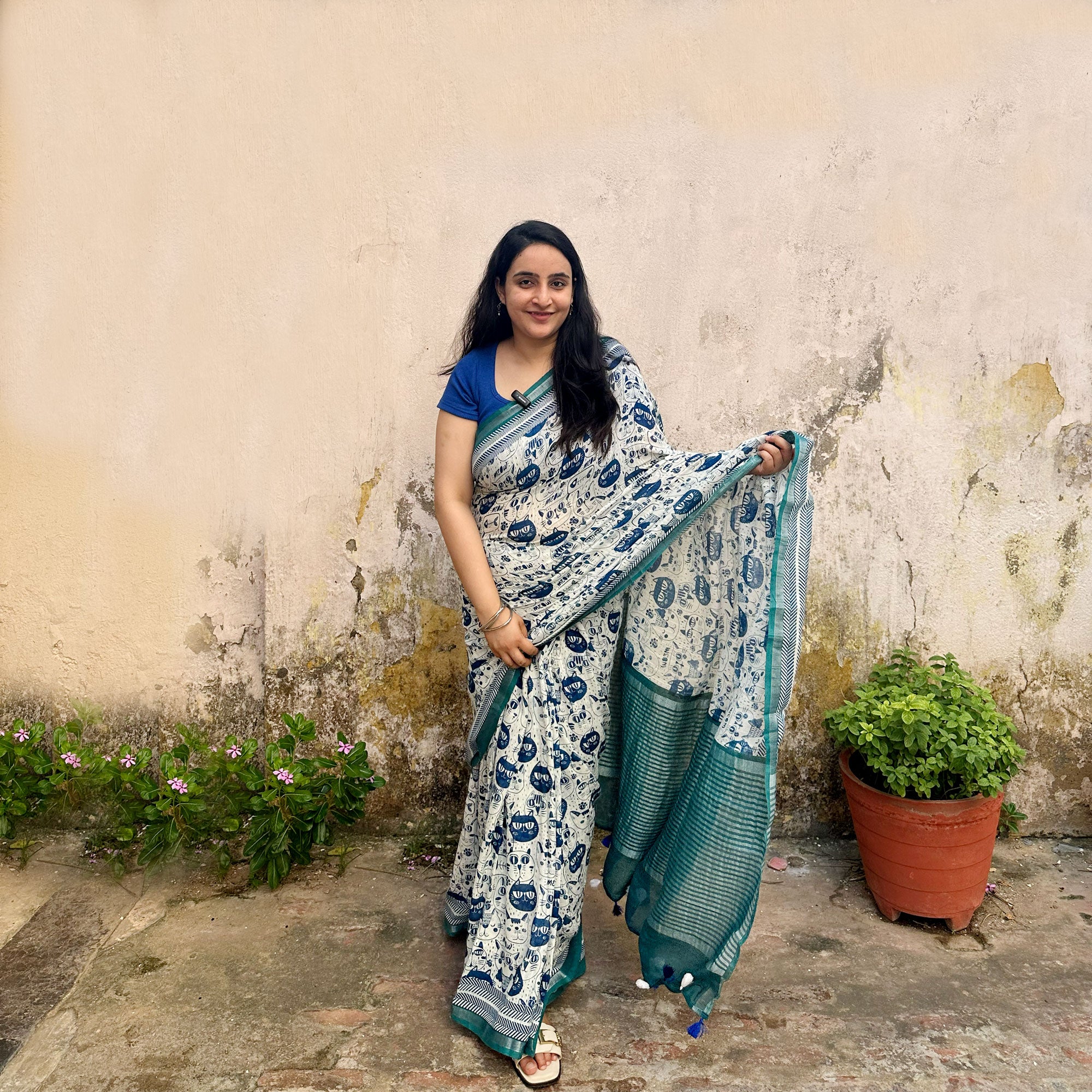 Founder wearing Catsablanca ivory cotton saree with navy meow cat face print, chevron border and teal zari pallu, Zoomies Collection by Thread Weavers