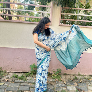 Founder wearing Catsablanca ivory cotton saree with navy meow cat face print, chevron border and teal zari pallu, Zoomies Collection by Thread Weavers