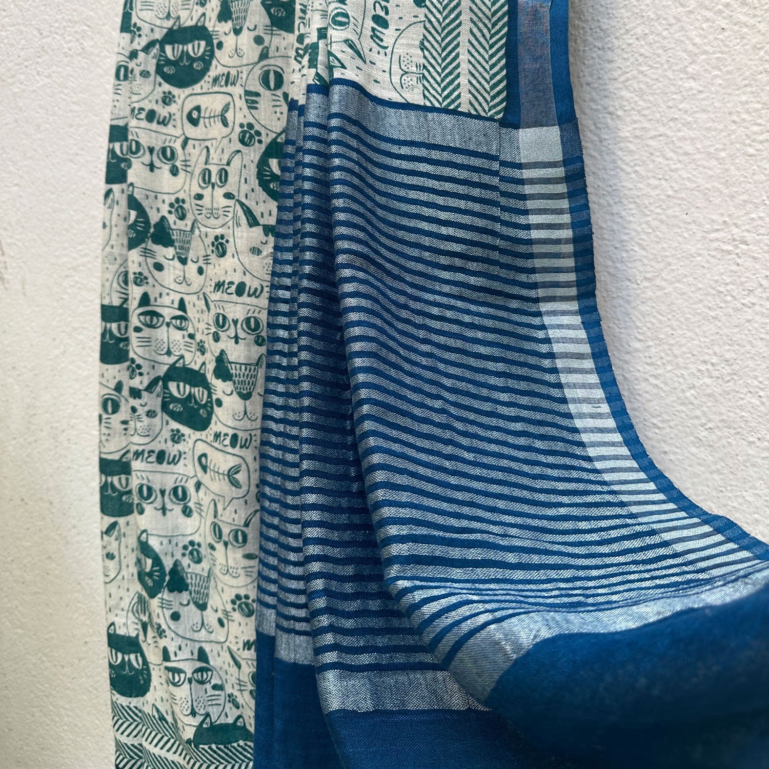 Say It Louder ivory cotton saree with teal meow cat face print, chevron border and navy zari pallu, Zoomies Collection Thread Weavers