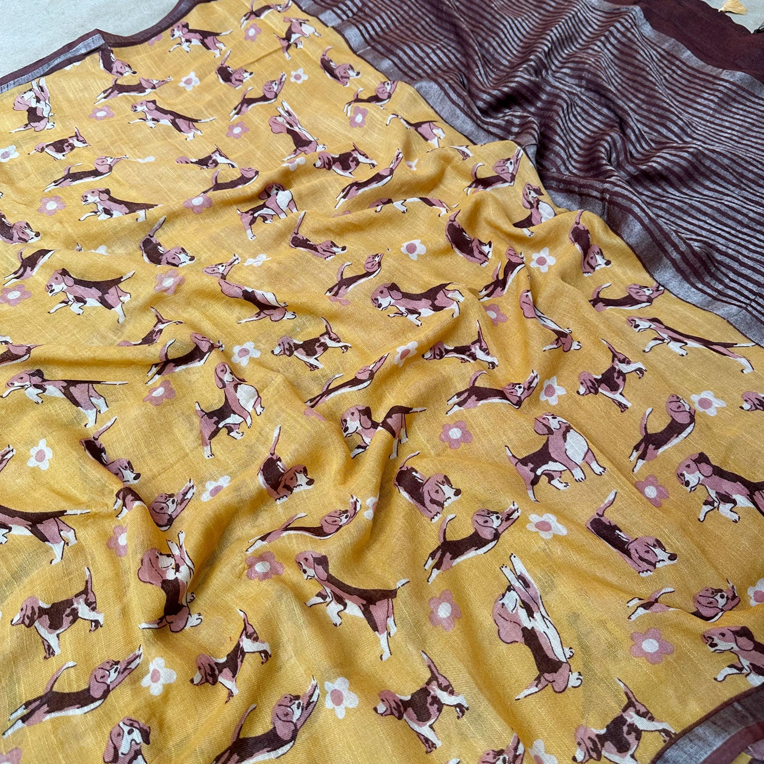 Sniff & Seek mustard cotton beagle print saree closeup with daisy florals and dark brown zari pallu, Zoomies Collection by The Thread Weavers