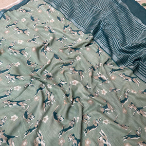 The Biscuit Hour sage green cotton beagle print saree closeup with daisy florals and dark teal zari pallu, Zoomies Collection Thread Weavers