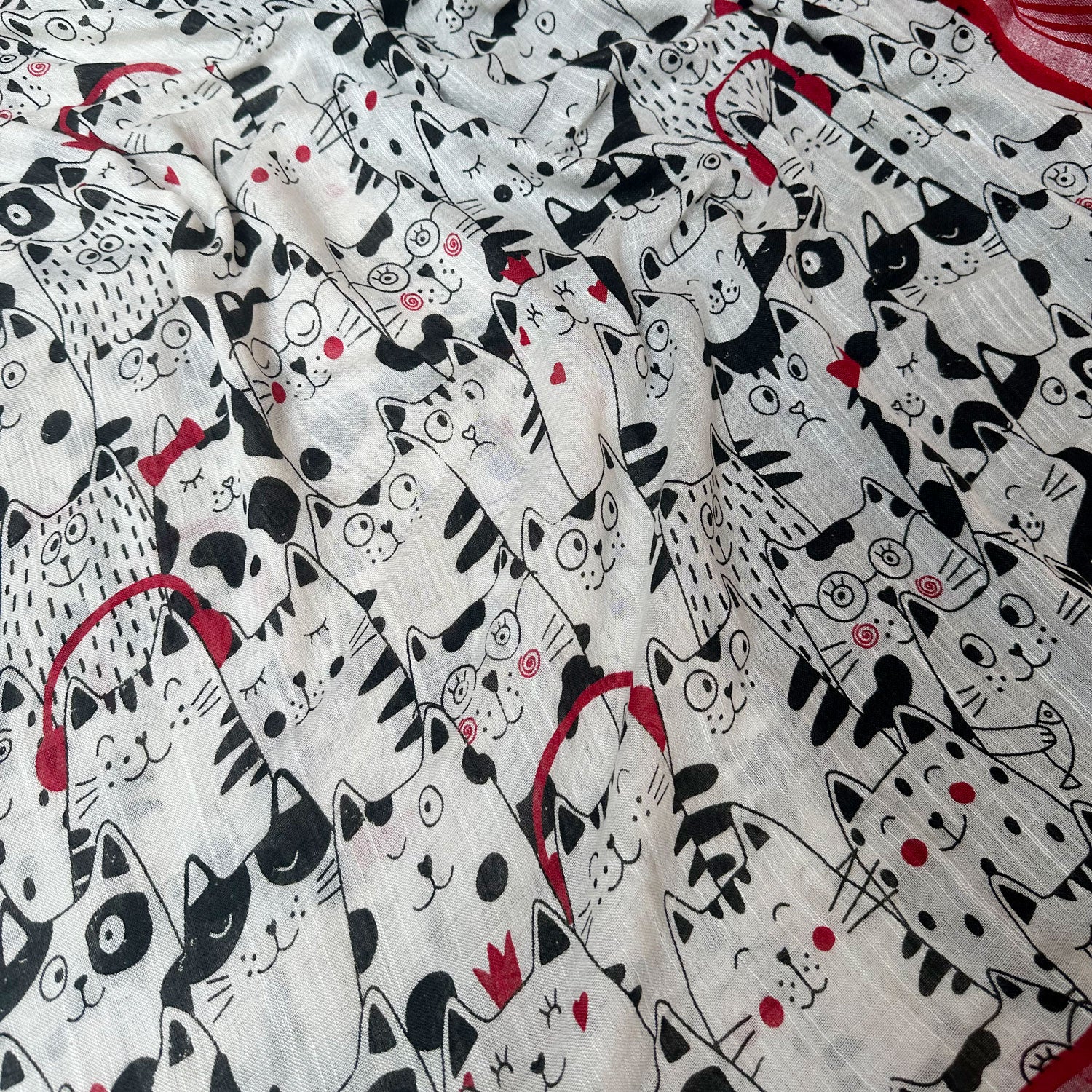The Great Catsby ivory cotton saree closeup with black illustrated cat crowd print and crimson red zari pallu, Zoomies Collection Thread Weavers
