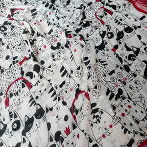 The Great Catsby ivory cotton saree closeup with black illustrated cat crowd print and crimson red zari pallu, Zoomies Collection Thread Weavers