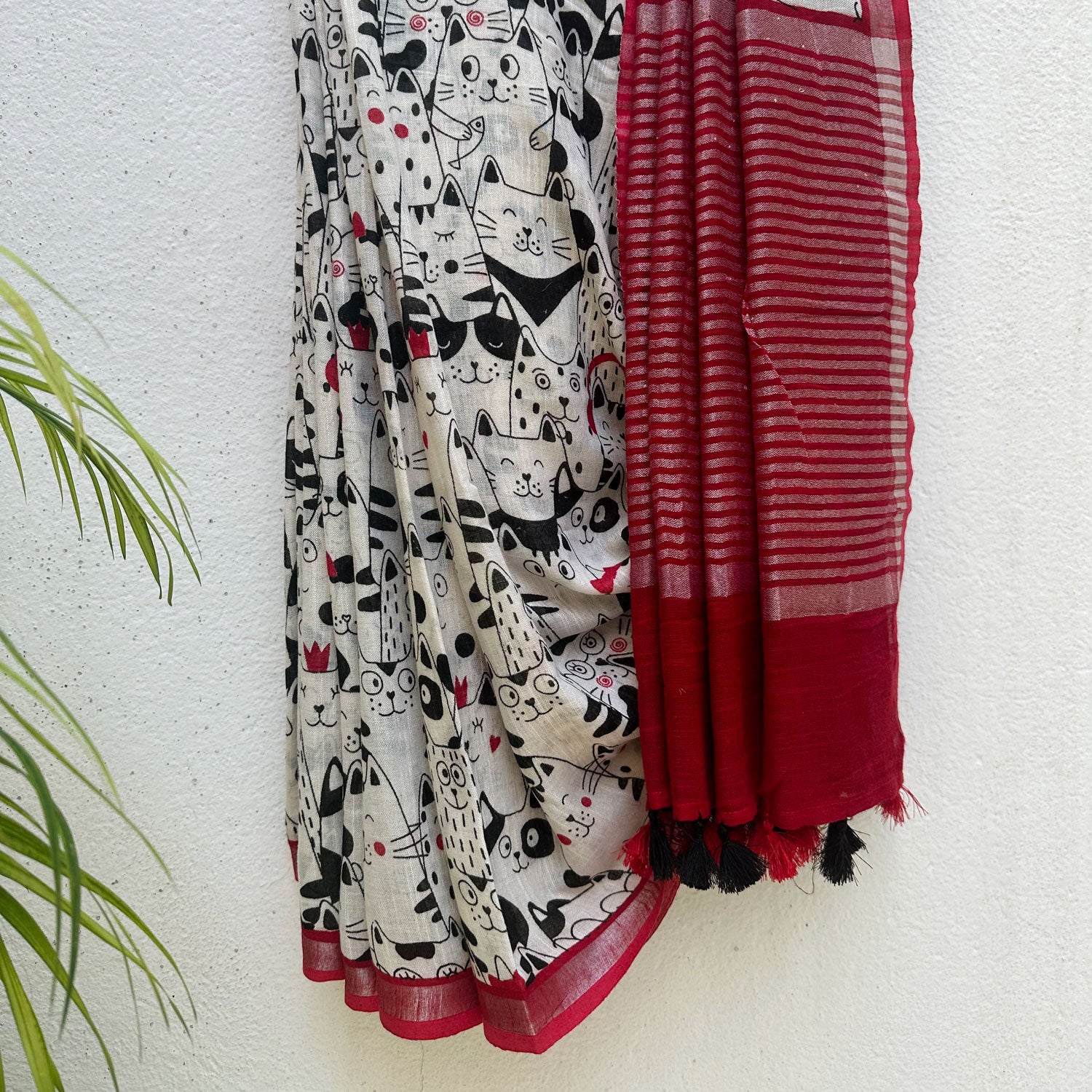 The Great Catsby ivory cotton saree with black illustrated cat crowd print and crimson red zari pallu, Zoomies Collection Thread Weavers