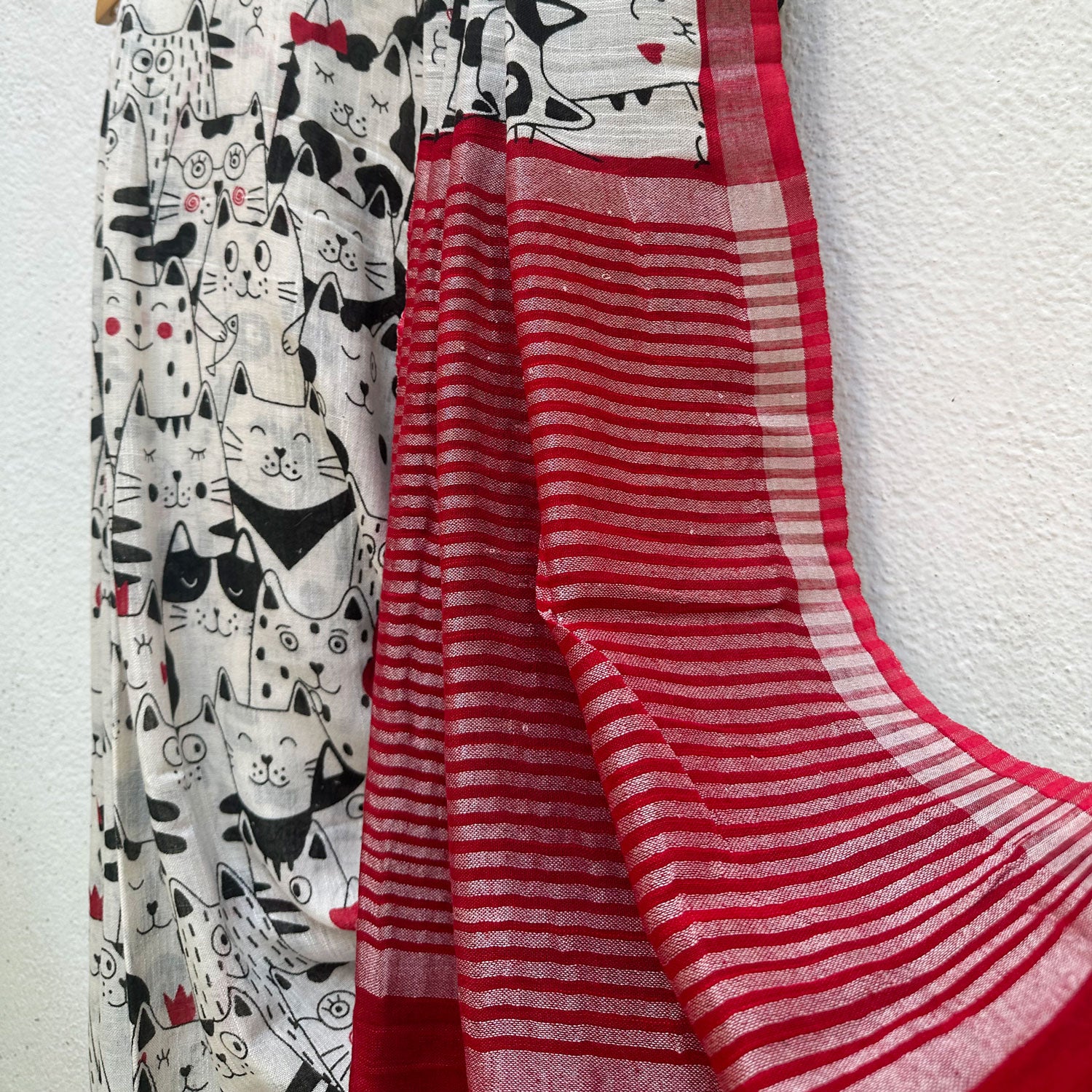 The Great Catsby ivory cotton saree with black illustrated cat crowd print and crimson red zari pallu, Zoomies Collection Thread Weavers