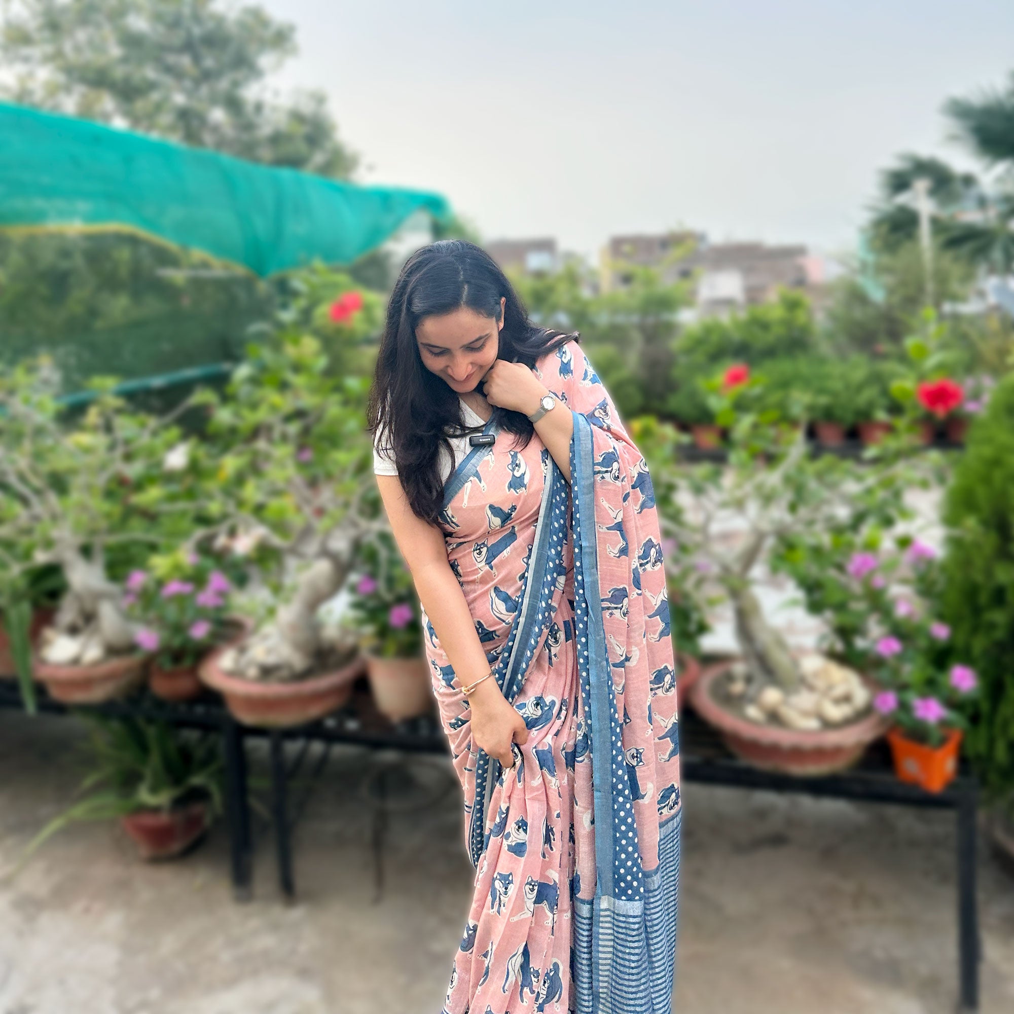 Founder wearing the Pawdcast blush pink cotton Shiba Inu dog print saree with polka dot border and steel blue zari pallu, Zoomies Collection TTW